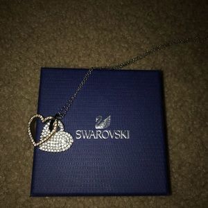 authentic Swarovski two hearts necklace.